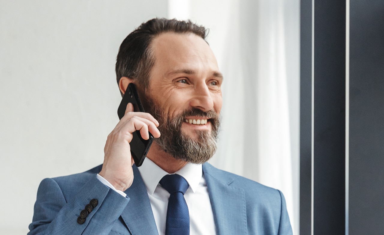 Business man happily discuss about the project success over phone
