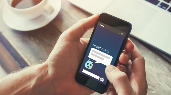 hands holding phone with chatbot open