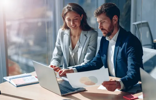 two people reviewing data