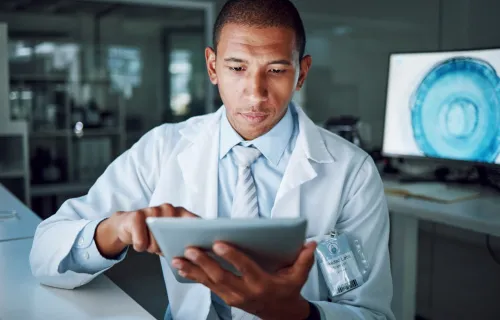 medical professional looking at data in a lab