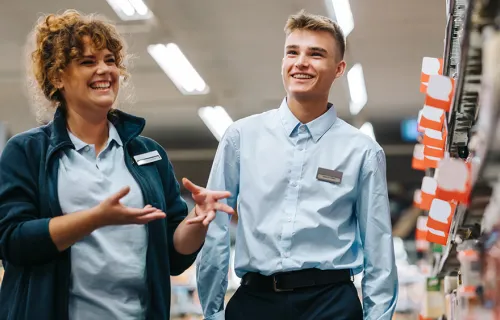 professionals with badge laughing over discussion