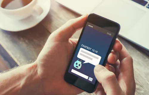 hands holding phone with chatbot open