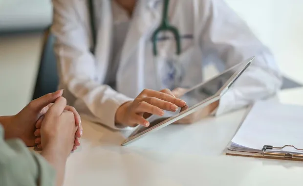Doctor helping patient