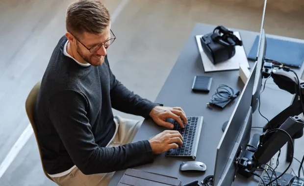 Male professional working on a laptop 